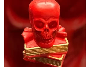 Teschio rosso su libri 10 cm.